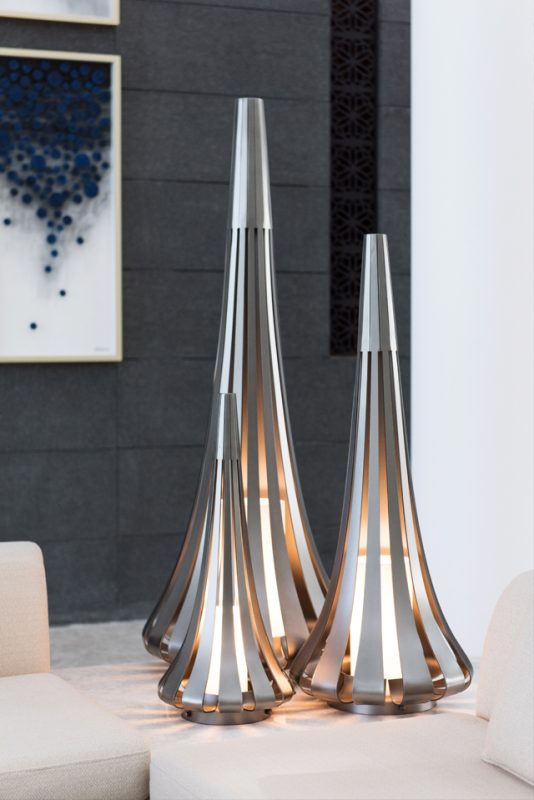 Luxury Interior Design - Luxury lamp with metal panes on cream leather sofa