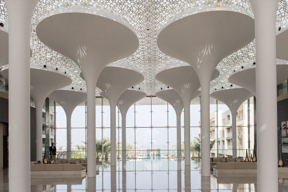 Hotel Interior Design - Molded GRP-paneled ceiling, illuminated columns, light marble floor & large glass windowpanes